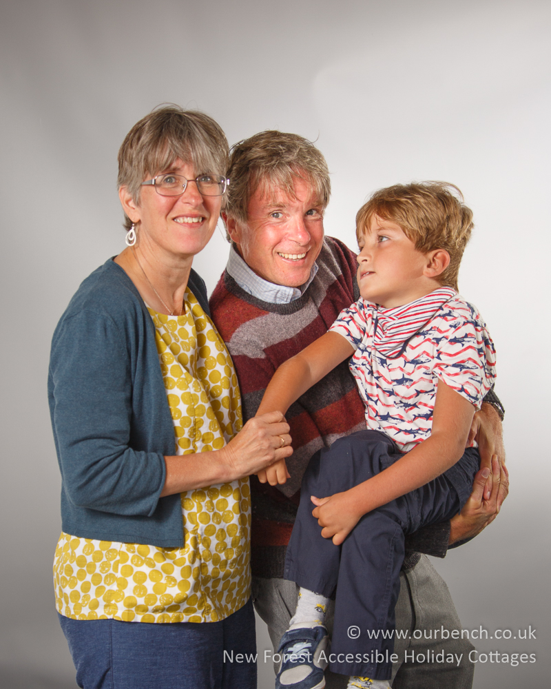 Sam supported by his parents during a relaxed family moment